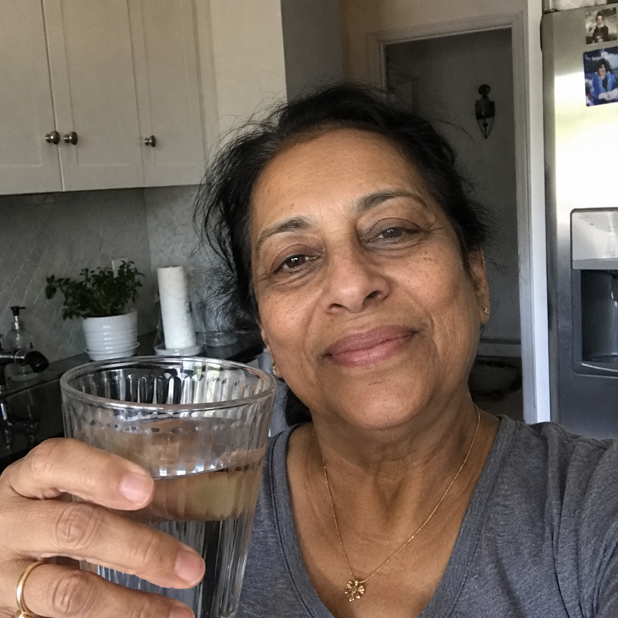 Priya K. with her OnTime Water delivery.